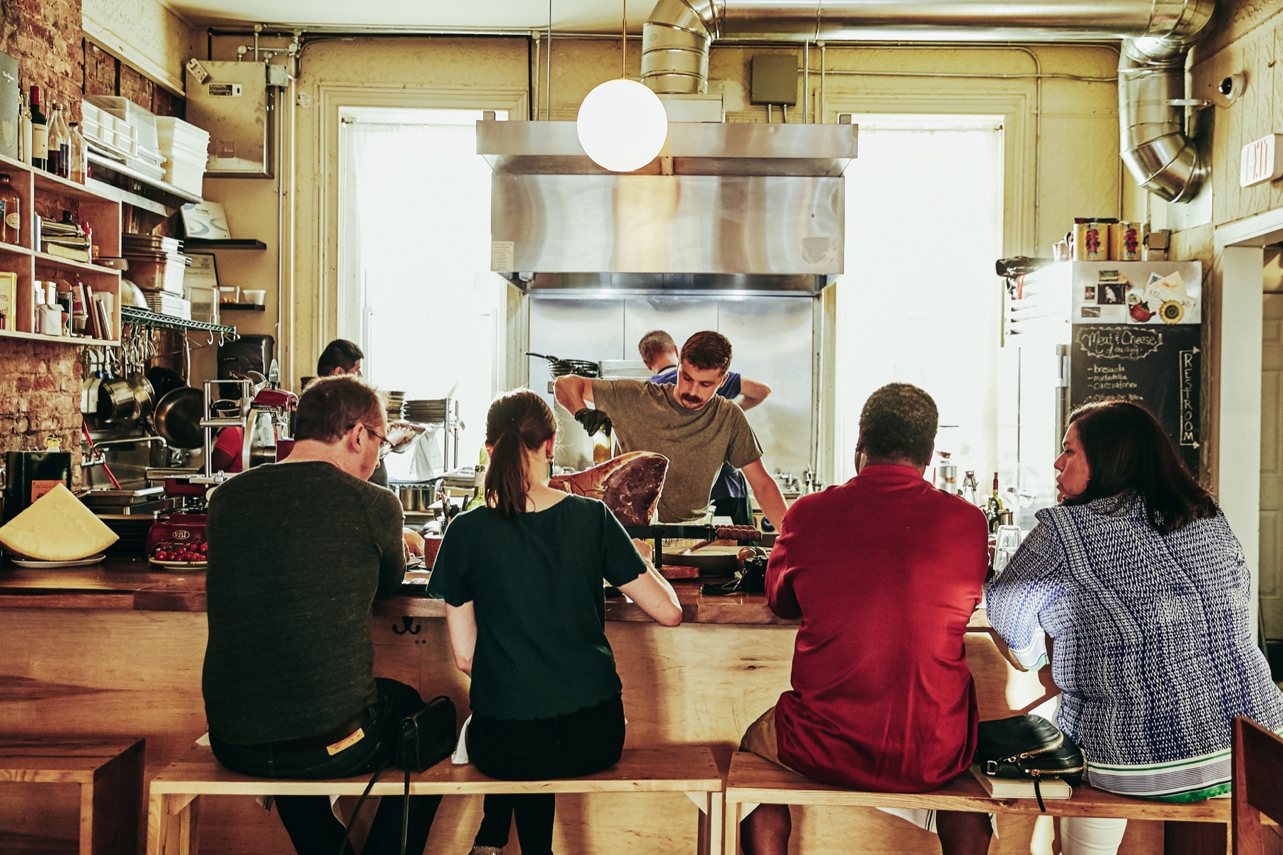 Matt Moschella working at the open kitchen counter in Jersey City
